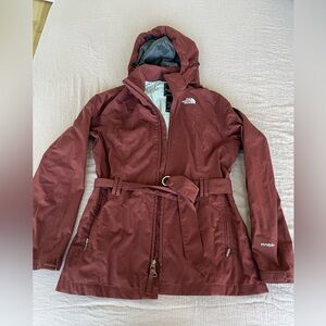 Women’s The North Face Burgundy Hooded Raincoat with belt size medium.